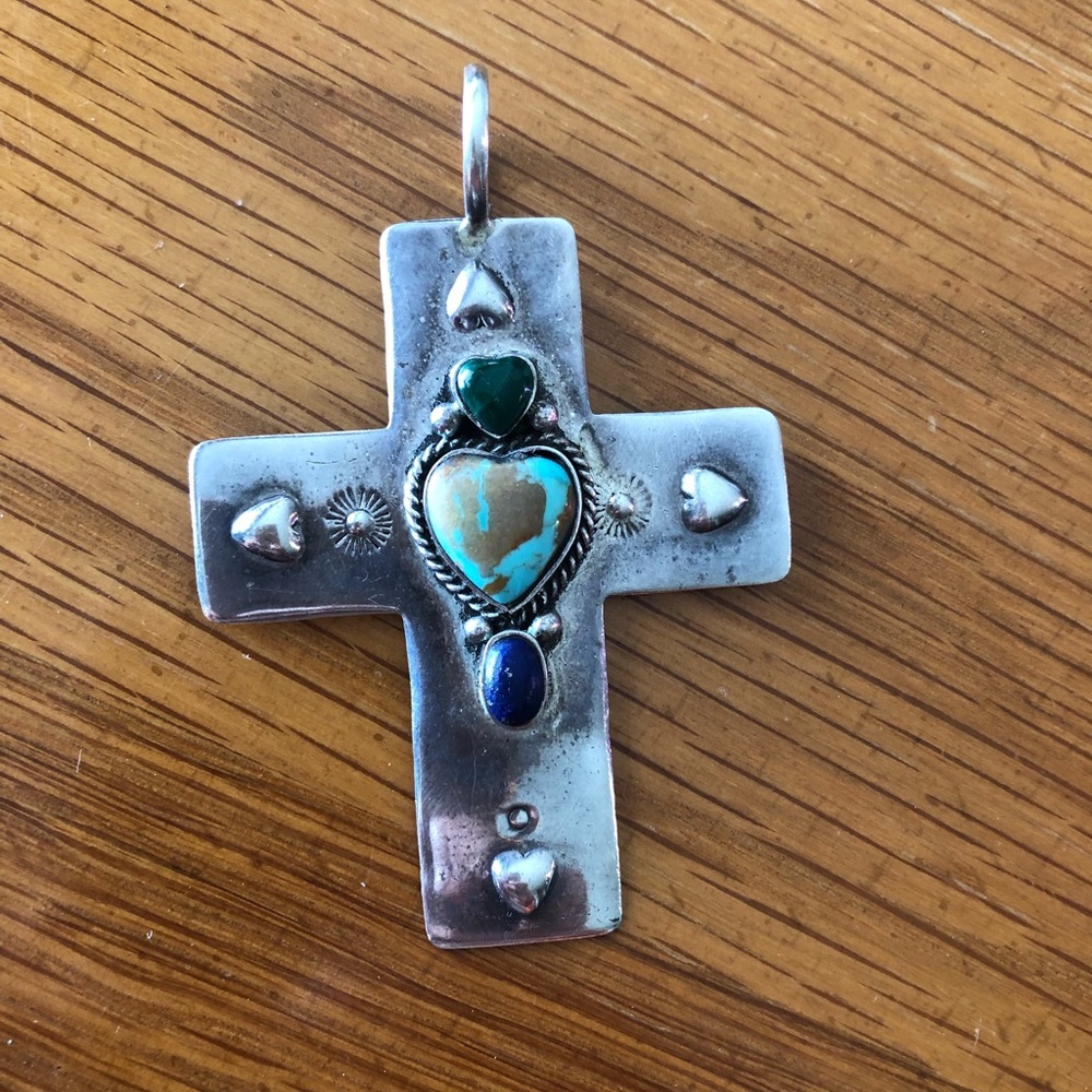 Sterling silver and turquoise cross pendant.